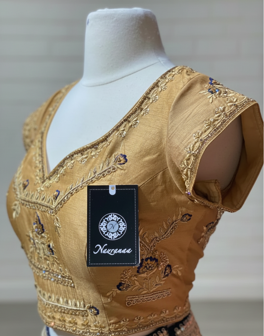 Full look: navy blue with a gold blouse lehenga with a net sequin dupatta