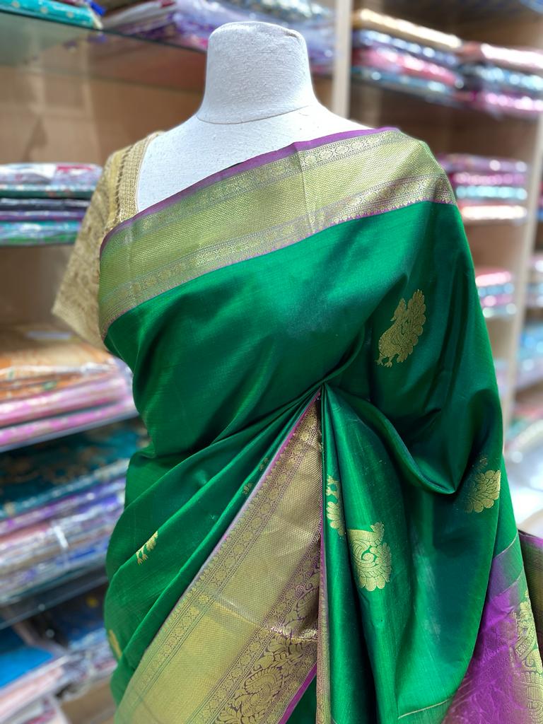 Emerald Green Kanjeevaram Silk Saree with Magenta Pallu and Temple Border