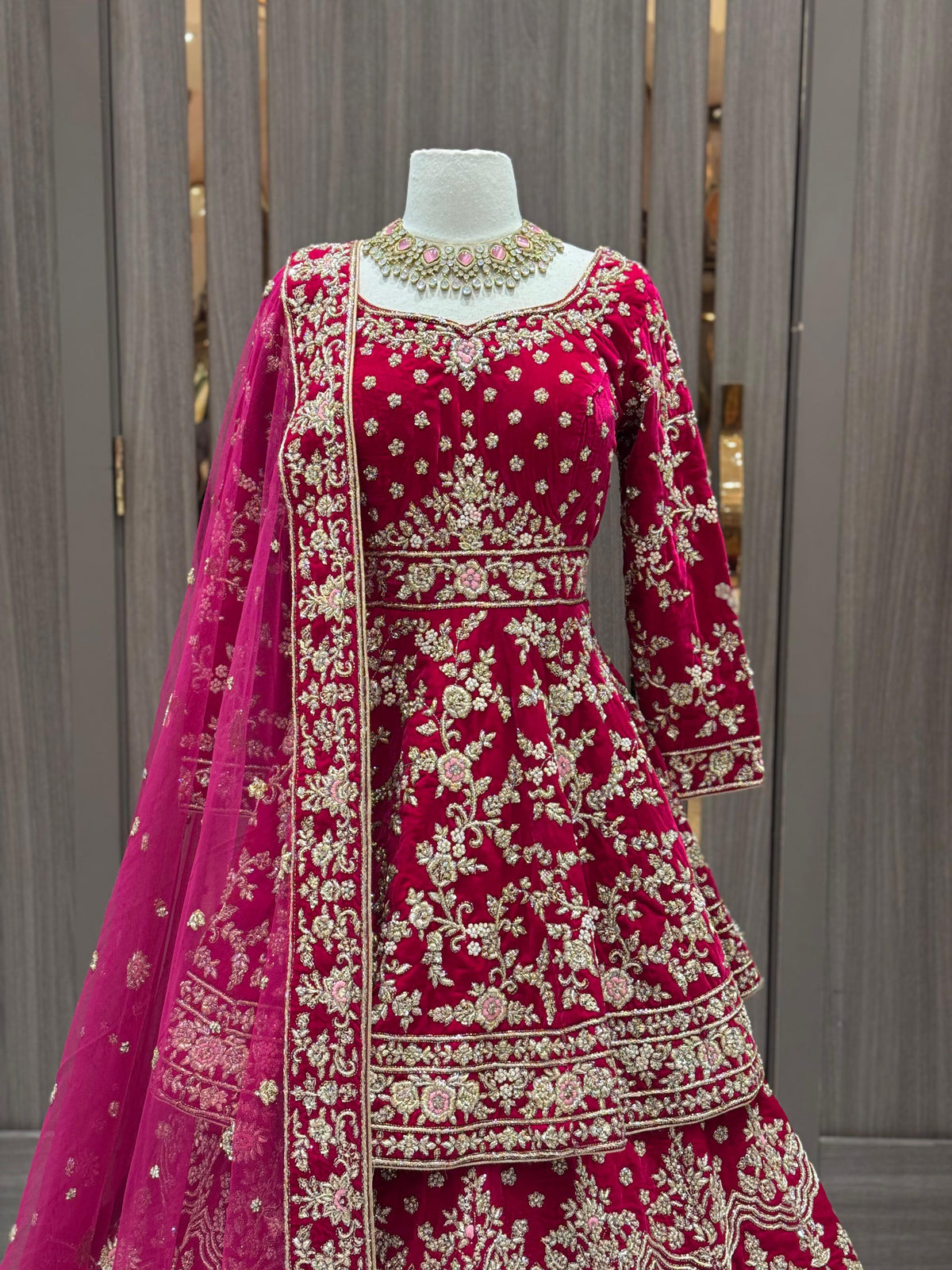 Rani Pink Velvet Bridal Lehenga with Gold Zari Work and Net Dupatta