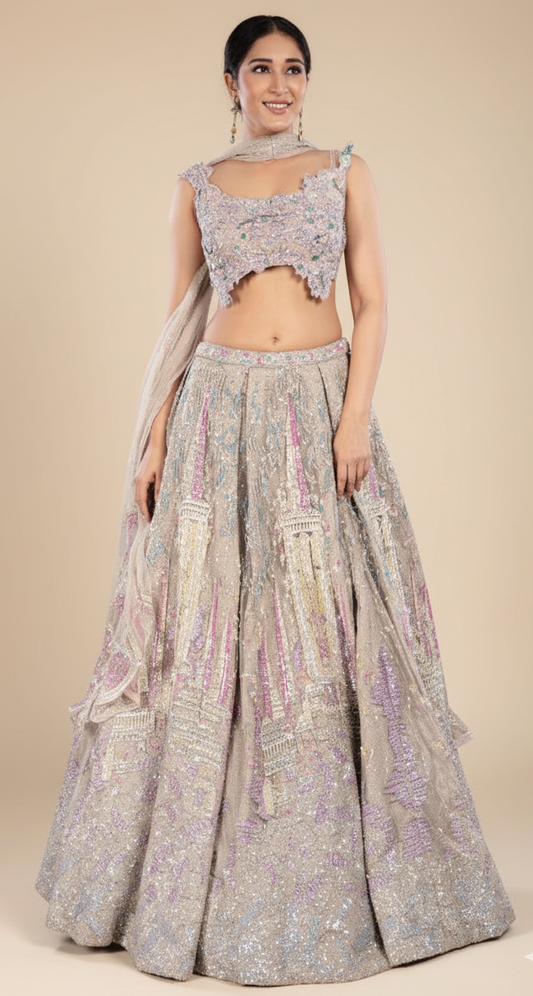 Beige with pink and green accents bridal lehenga with a generous flare in net, Nazranaa