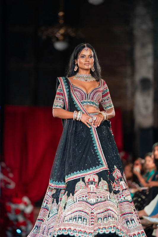Dakshineshwar Kali black lehenga with a multicolor temple-motif border and embroidered blouse, shown full length on the runway