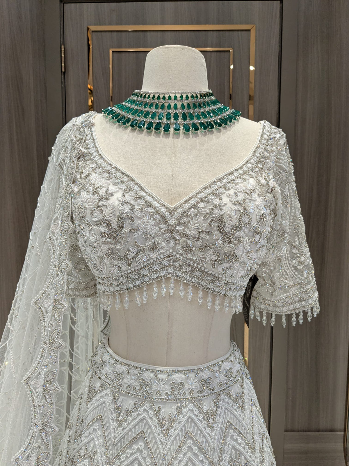 White Tonal Bridal Lehenga with Silver Stones, Pearls and Sequin Work