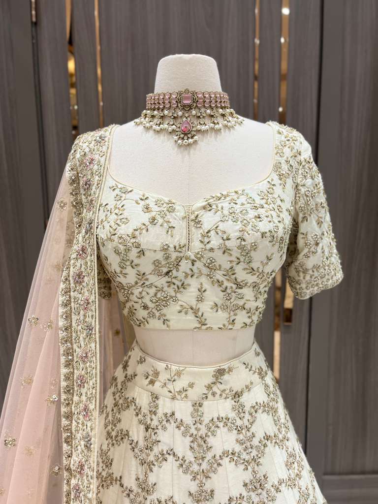 Ivory Bridal Lehenga with Gold and Pastel Embroidery and Net Dupatta