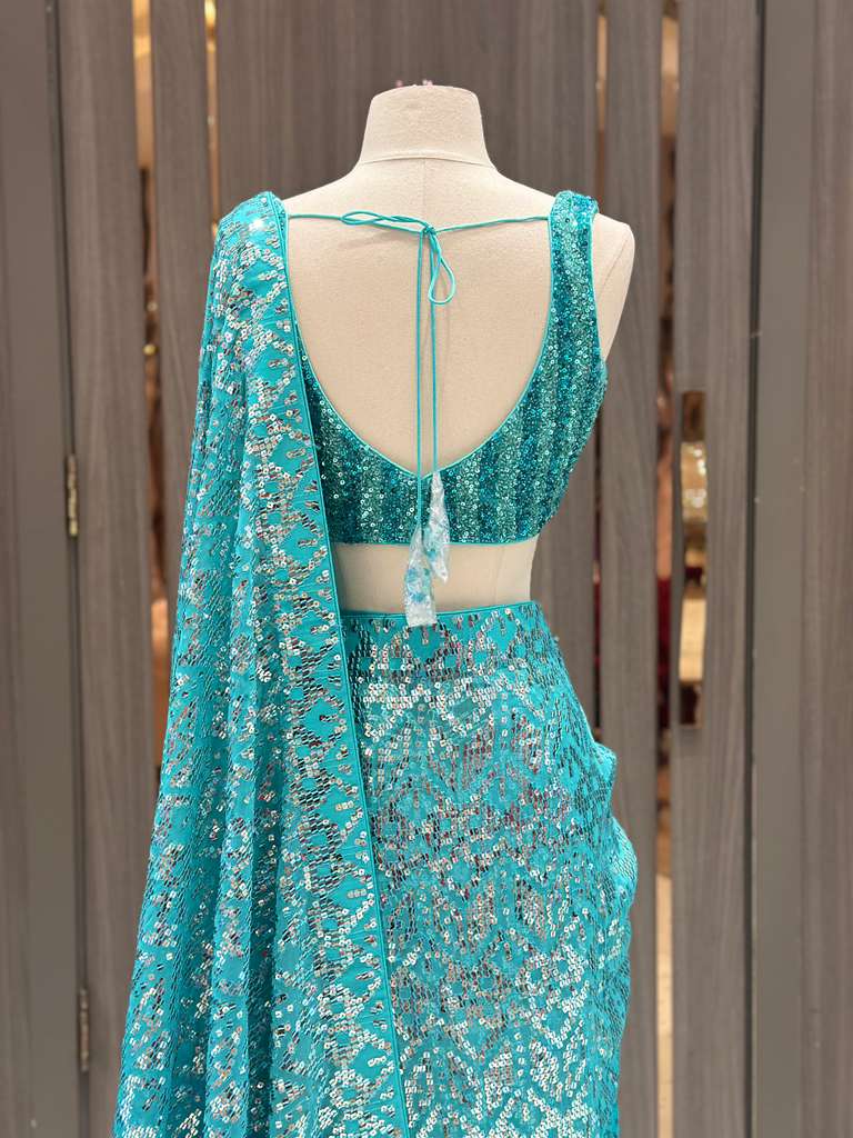 Aqua Blue Sequin Saree with Stripe Work and Sleeveless Blouse