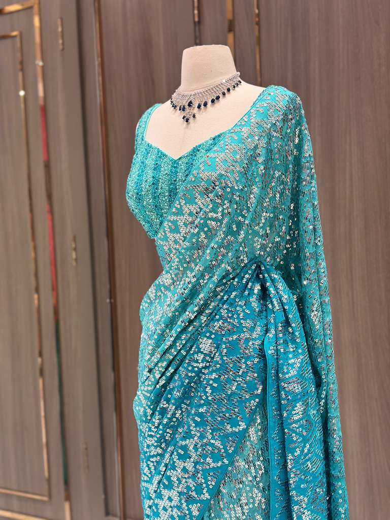 Aqua Blue Sequin Saree with Stripe Work and Sleeveless Blouse