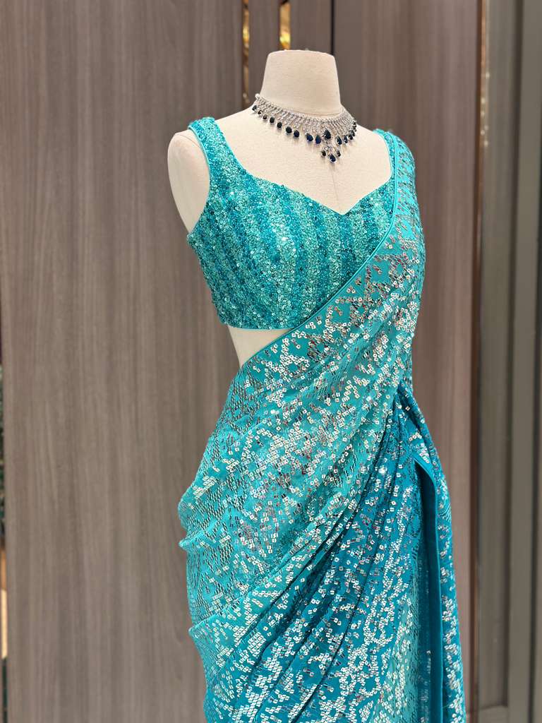 Aqua Blue Sequin Saree with Stripe Work and Sleeveless Blouse