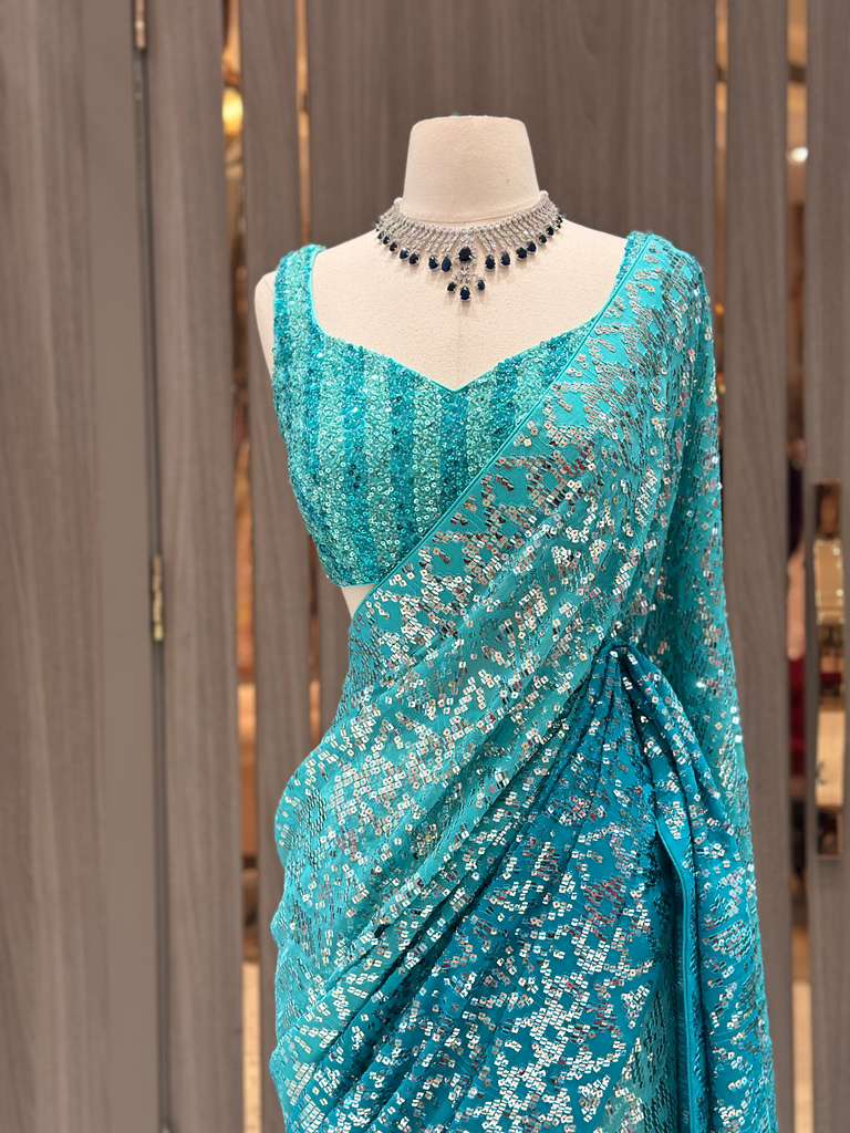 Aqua Blue Sequin Saree with Stripe Work and Sleeveless Blouse