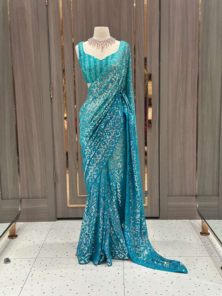 Aqua Blue Sequin Saree with Stripe Work and Sleeveless Blouse
