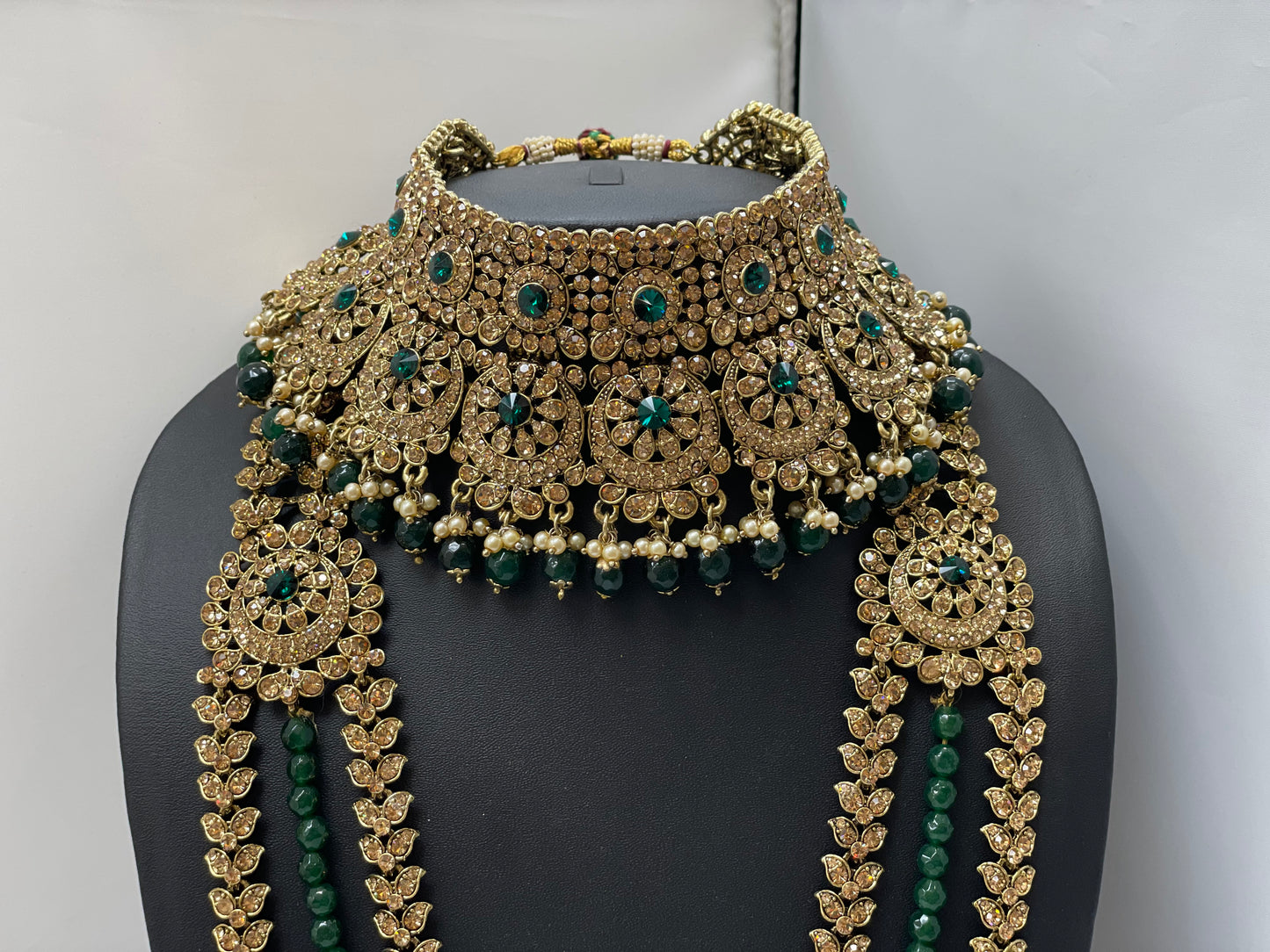 Bridal gold jewelry with emerald accents