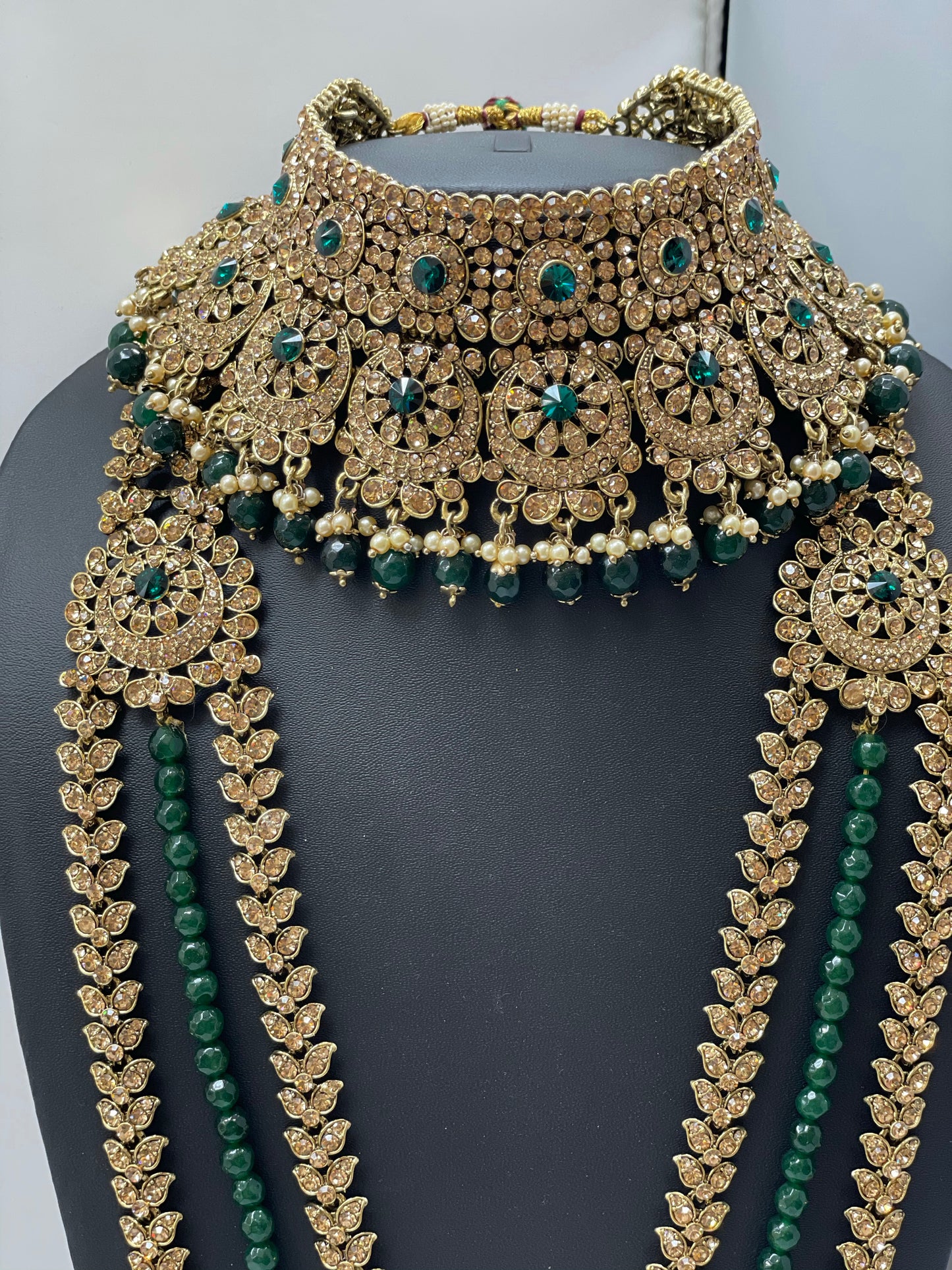 Bridal gold jewelry with emerald accents